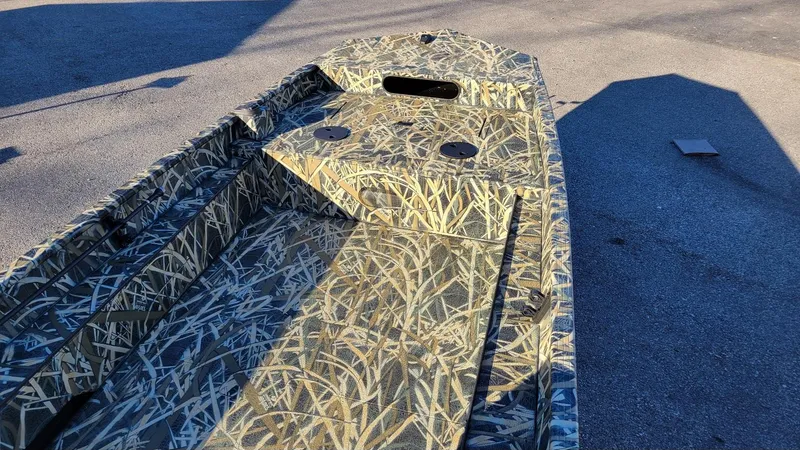 Slide: The Image of 2025 Smoker Craft Sportsman 1660 boat with Mossy Oak Camo design, in stock. - 8