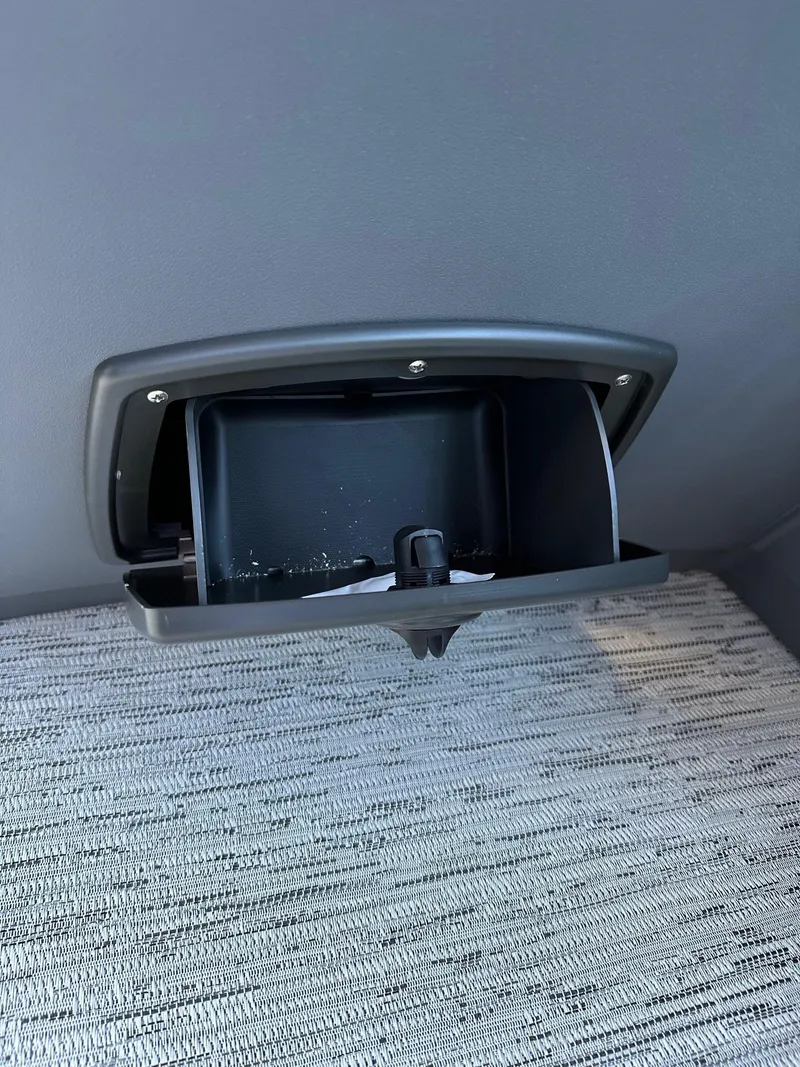 Slide: The Image of 2025 Bennington 21 SSR Quad Bench storage compartment detail. - 25