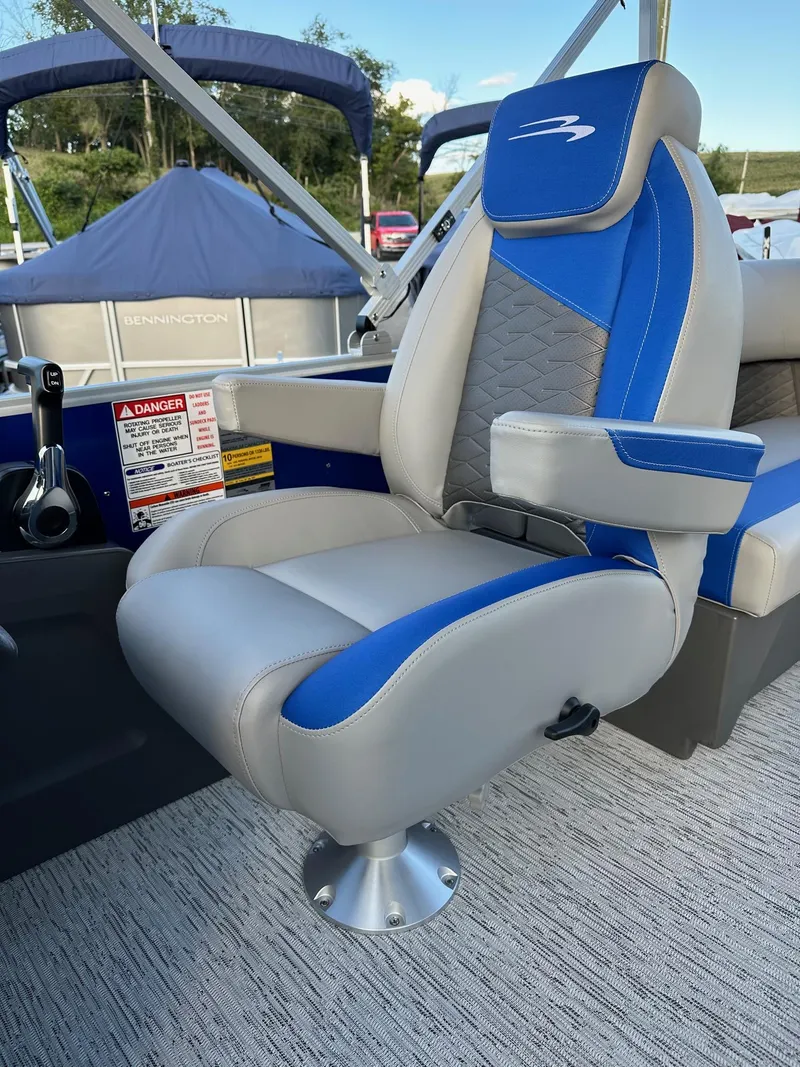 Slide: The Image of 2025 Bennington 21 SSR Quad Bench boat seat, blue and gray design, luxury interior. - 27