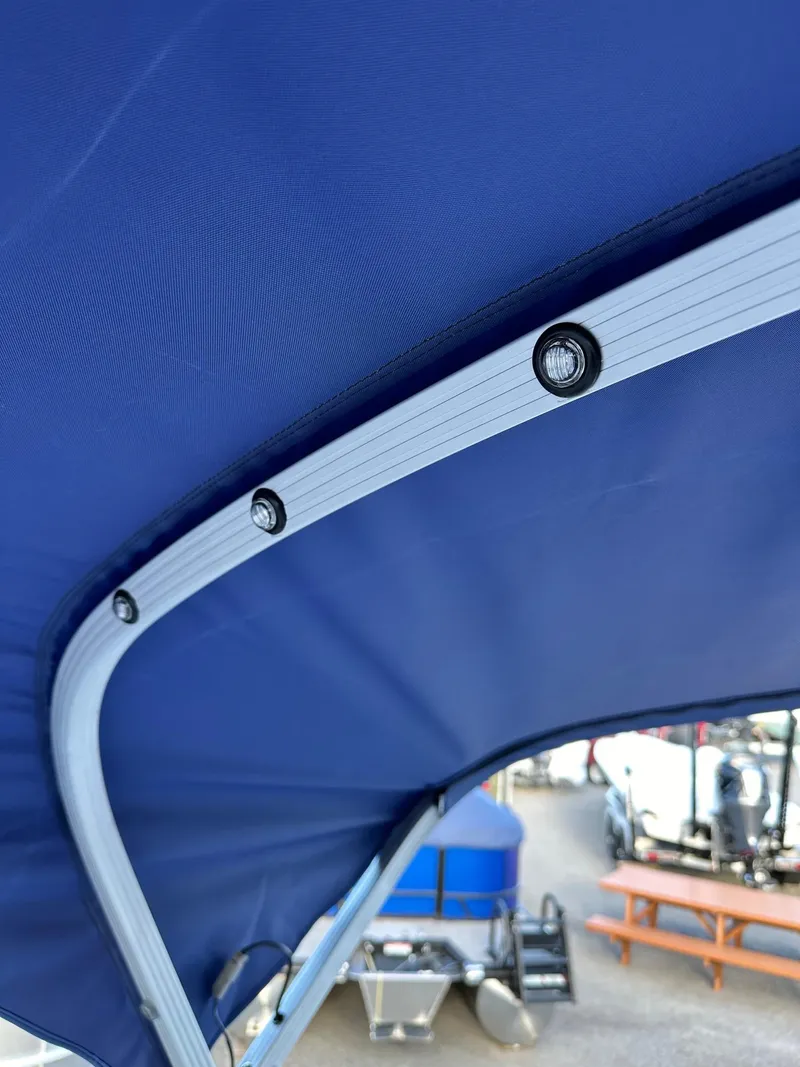 Slide: The Image of 2025 Bennington 21 SSR Quad Bench boat canopy with integrated LED lights. - 28