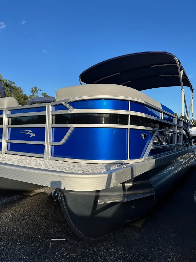 Slide: The Image of 2025 Bennington 21 SSR Quad Bench pontoon boat, blue exterior, in stock. - 30
