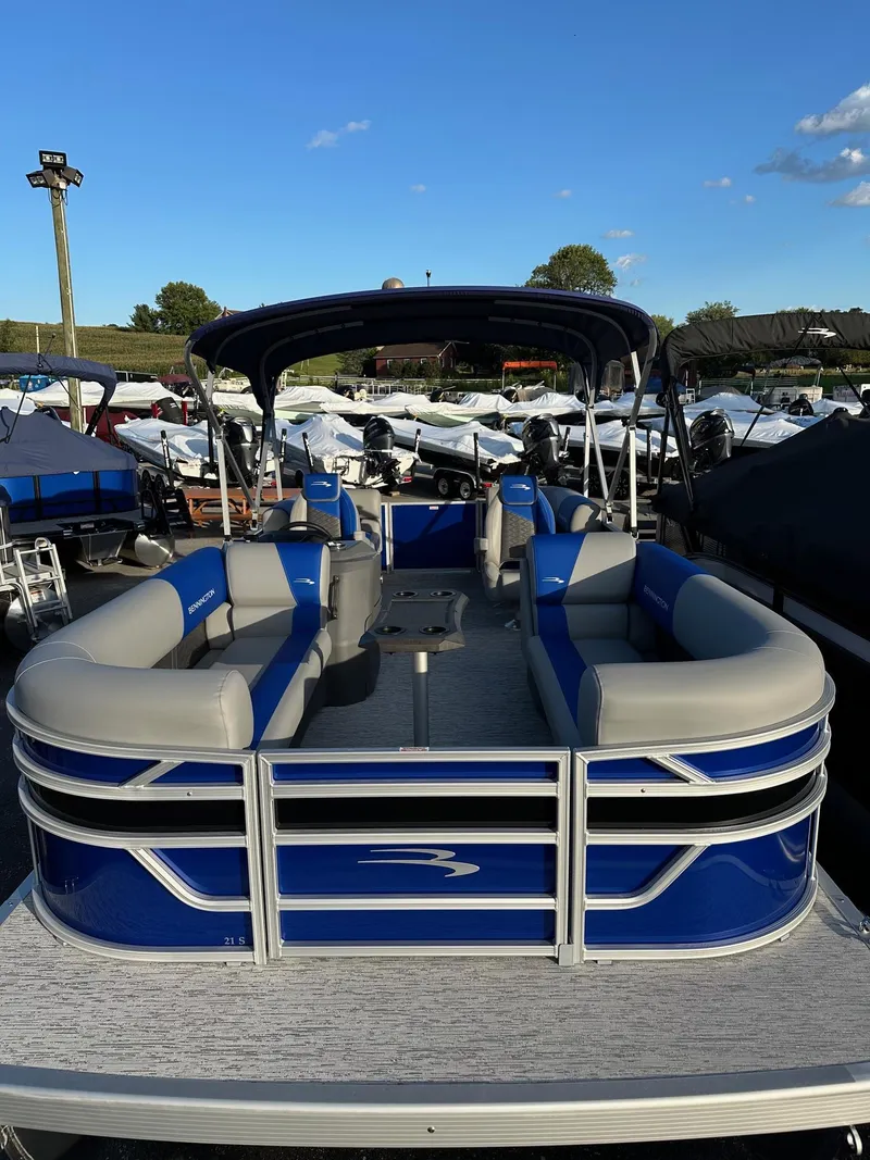 Slide: The Image of 2025 Bennington 21 SSR Quad Bench pontoon boat, blue and gray seating, in stock. - 31