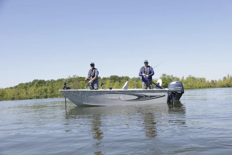 Slide: The Image of 2023 Smoker Craft Freedom 16 boat with Yamaha 50 hp engine on a calm lake. - 12