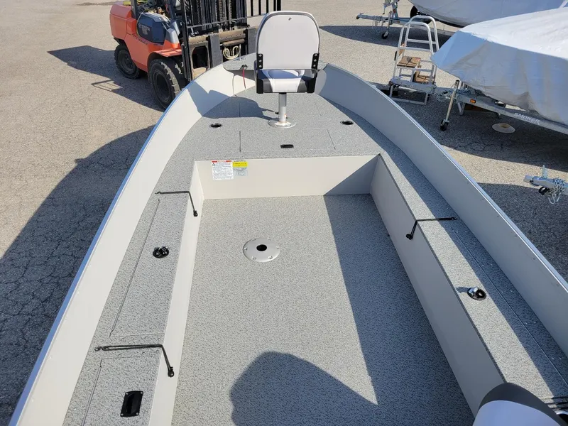 Slide: The Image of 2025 Smoker Craft 16' Angler Patriot Tiller fishing boat interior, featuring seating and storage. - 11