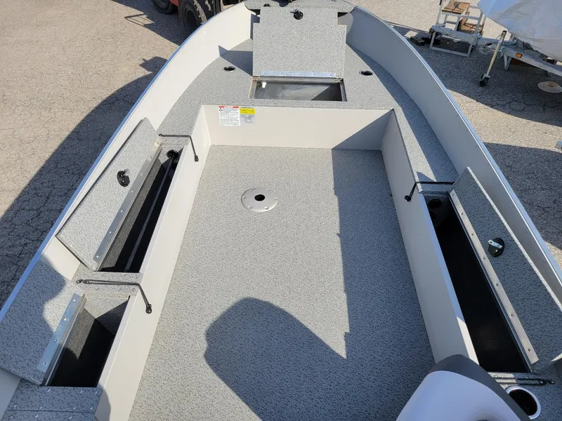 Slide: The Image of 2025 Smoker Craft 16' Angler Patriot Tiller fishing boat interior, showcasing storage compartments. - 12