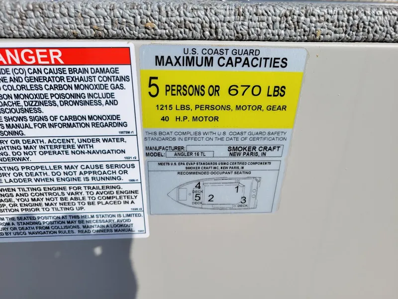 Slide: The Image of 2025 Smoker Craft 16' Angler Patriot Tiller boat capacity label, 5 persons or 670 lbs. - 13