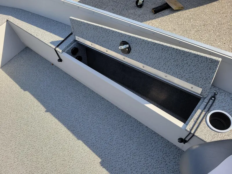Slide: The Image of 2025 Smoker Craft 16' Angler Patriot Tiller fishing boat interior storage compartment. - 3