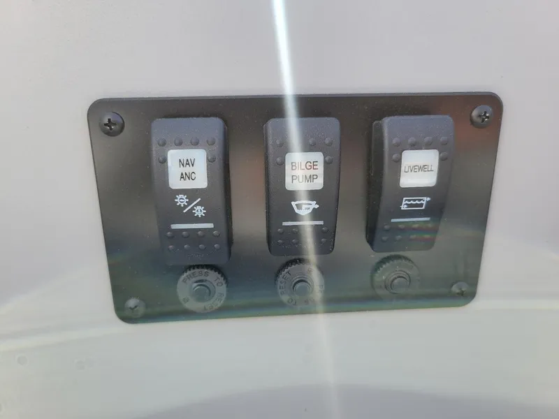 Slide: The Image of Control panel of 2025 Smoker Craft Angler Patriot Tiller fishing boat. - 8