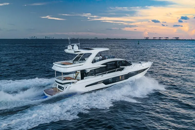 Slide: The Image of 2023 Galeon 680 Fly yacht cruising at sunset. - 11