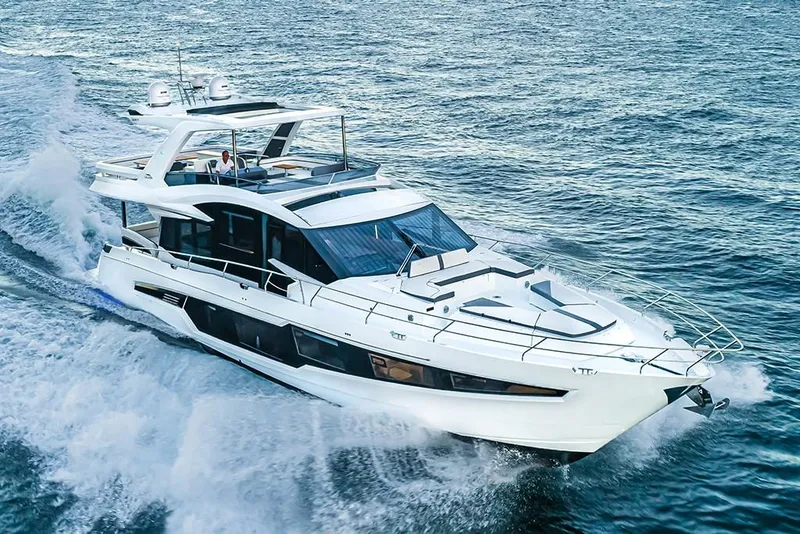 Slide: The Image of 2023 Galeon 680 Fly yacht cruising on open water. - 13