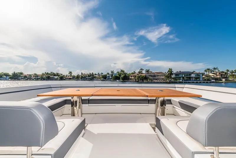 Slide: The Image of Luxury seating area on the 2023 Galeon 680 Fly yacht with waterfront view. - 16