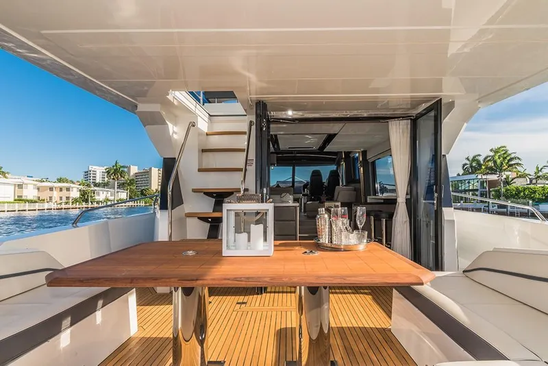 Slide: The Image of Luxury outdoor dining area on the 2023 Galeon 680 Fly yacht. - 21