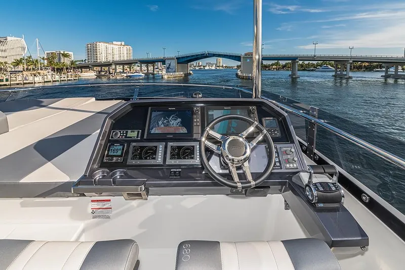 Slide: The Image of Helm of 2023 Galeon 680 Fly yacht with bridge and waterfront view. - 27