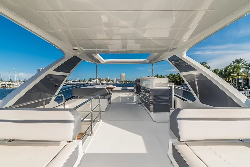 Slide: The Image of 2023 Galeon 680 Fly yacht flybridge with modern seating and ocean view. - 29