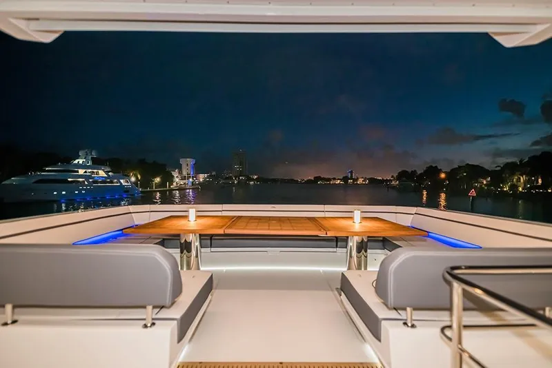 Slide: The Image of Luxury seating area on the 2023 Galeon 680 Fly yacht at night. - 37