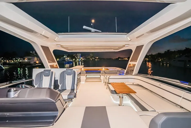 Slide: The Image of Luxurious 2023 Galeon 680 Fly yacht interior at night, featuring spacious seating and modern design. - 38