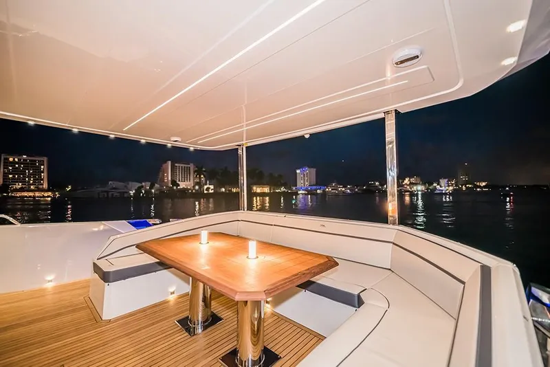Slide: The Image of Luxurious 2023 Galeon 680 Fly yacht deck with night city view. - 39