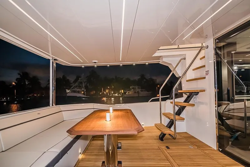 Slide: The Image of Luxurious 2023 Galeon 680 Fly yacht interior with elegant seating and wooden table. - 40