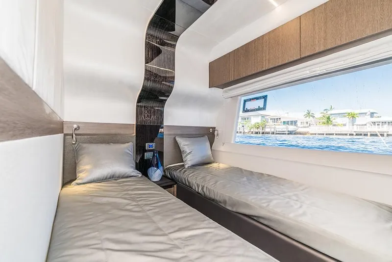 Slide: The Image of 2023 Galeon 680 Fly cabin with twin beds and large window. - 42
