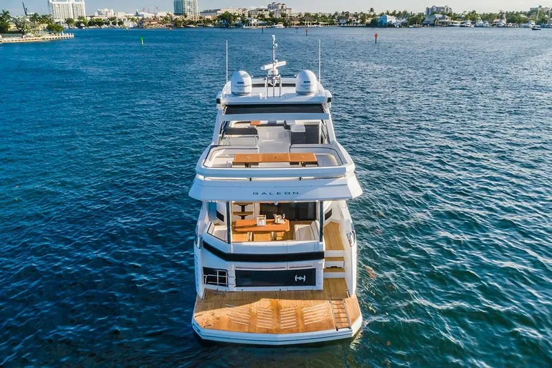Slide: The Image of 2023 Galeon 680 Fly yacht on open water, rear view. - 7