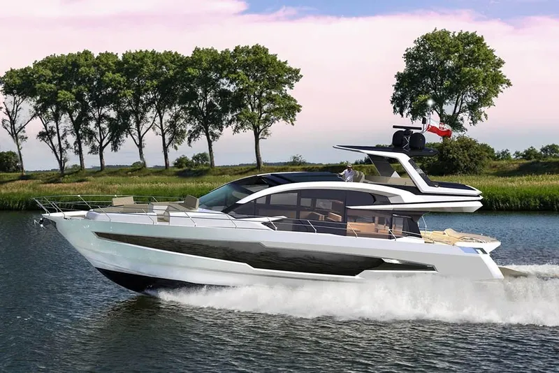 Slide: The Image of 2023 Galeon 700 Sky yacht cruising on a river with trees in the background. - 4