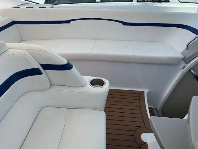 Slide: The Image of Luxurious seating area on a 2009 Formula 45 Yacht with white and blue upholstery. - 13