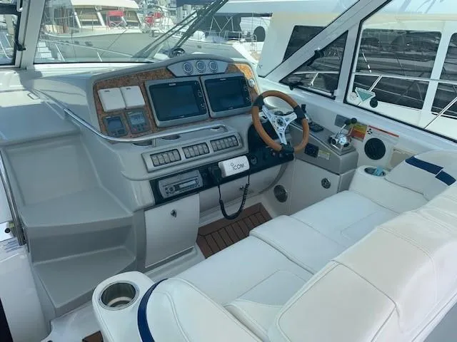Slide: The Image of 2009 Formula 45 Yacht cockpit with modern controls and white seating. - 14