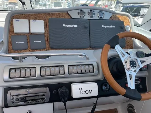 Slide: The Image of 2009 Formula 45 Yacht dashboard with Raymarine navigation and ICOM communication systems. - 15