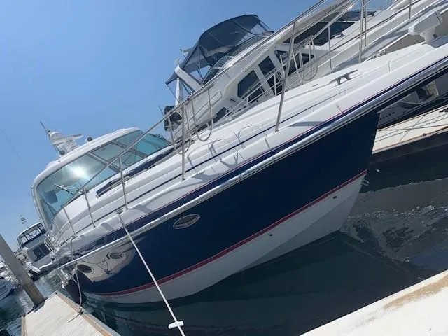 Slide: The Image of 2009 Formula 45 Yacht docked at marina under clear blue sky. - 2