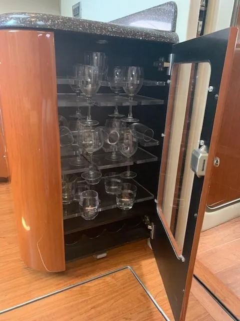 Slide: The Image of Glass cabinet with wine glasses inside a 2009 Formula 45 Yacht interior. - 21