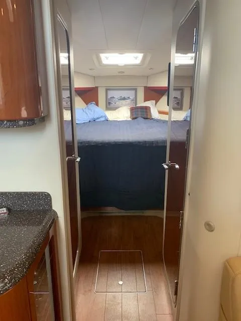 Slide: The Image of Interior view of 2009 Formula 45 Yacht cabin with bed and wooden flooring. - 23