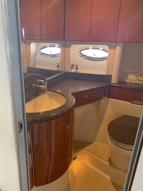 Slide: The Image of 2009 Formula 45 Yacht bathroom with wood cabinetry and modern fixtures. - 24