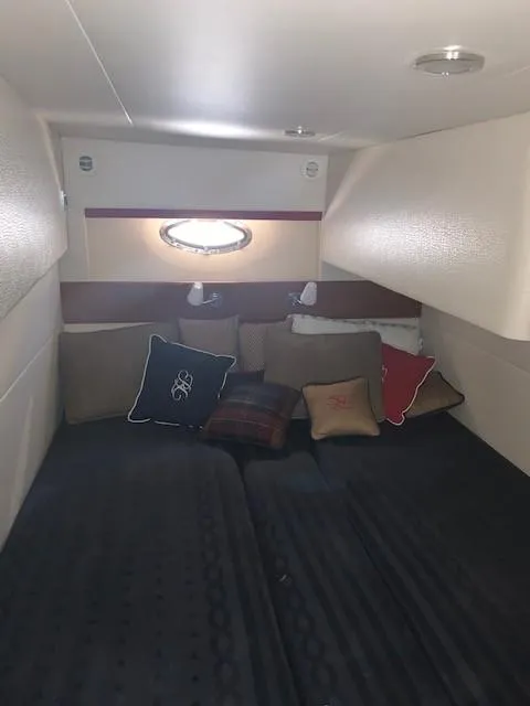 Slide: The Image of Interior cabin of 2009 Formula 45 Yacht with cozy bedding and decorative pillows. - 25