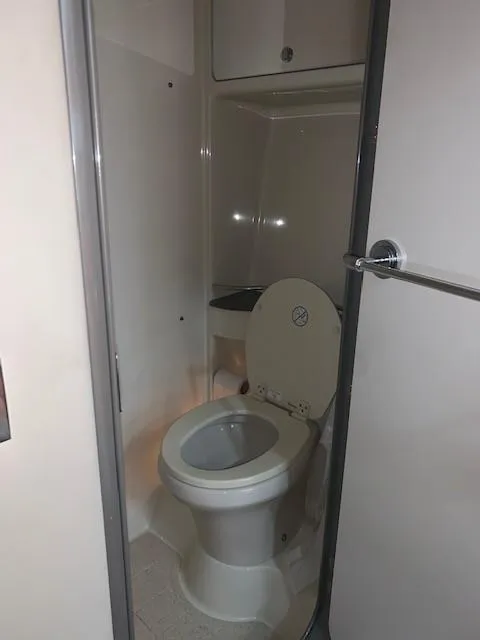 Slide: The Image of 2009 Formula 45 Yacht bathroom with compact toilet and storage cabinet. - 27