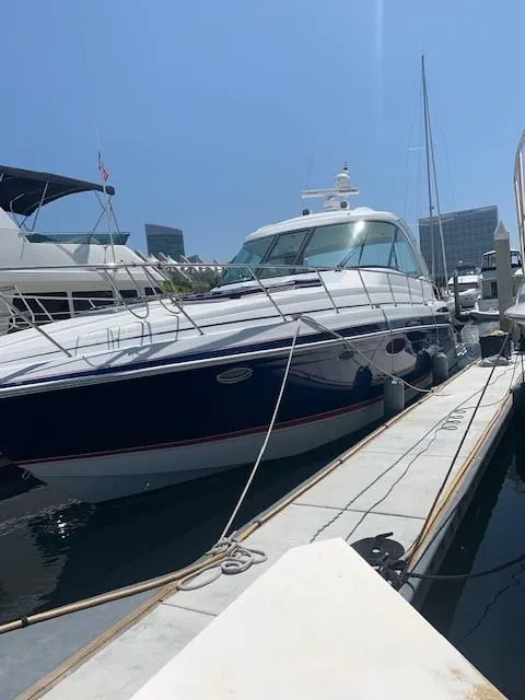 Slide: The Image of 2009 Formula 45 Yacht docked at marina under clear blue sky. - 4