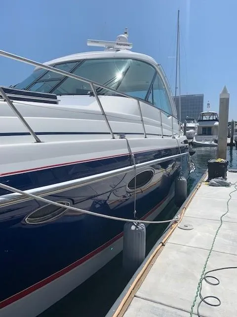 Slide: The Image of 2009 Formula 45 Yacht docked at marina under clear blue sky. - 5