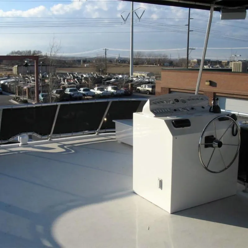 Slide: The Image of Upper deck of 2006 Sumerset Midnight Magic Trip 2 houseboat with steering console. - 11