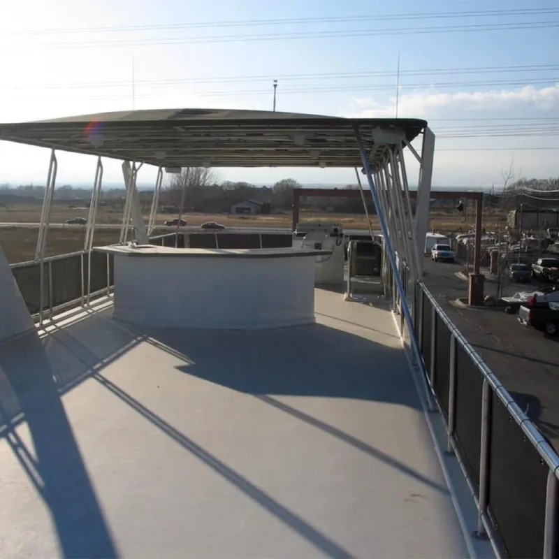 Slide: The Image of Top deck of 2006 Sumerset Midnight Magic Trip 2 houseboat with shaded seating area. - 12