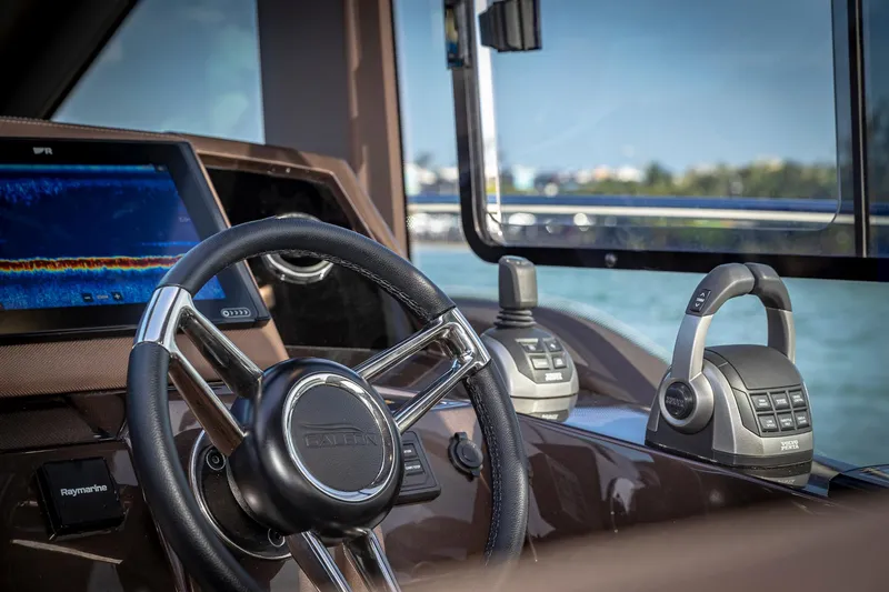 Slide: The Image of Helm of 2023 Galeon 425 HTS yacht with modern controls and navigation display. - 15