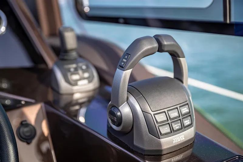 Slide: The Image of Close-up of the 2023 Galeon 425 HTS yacht throttle controls. - 16