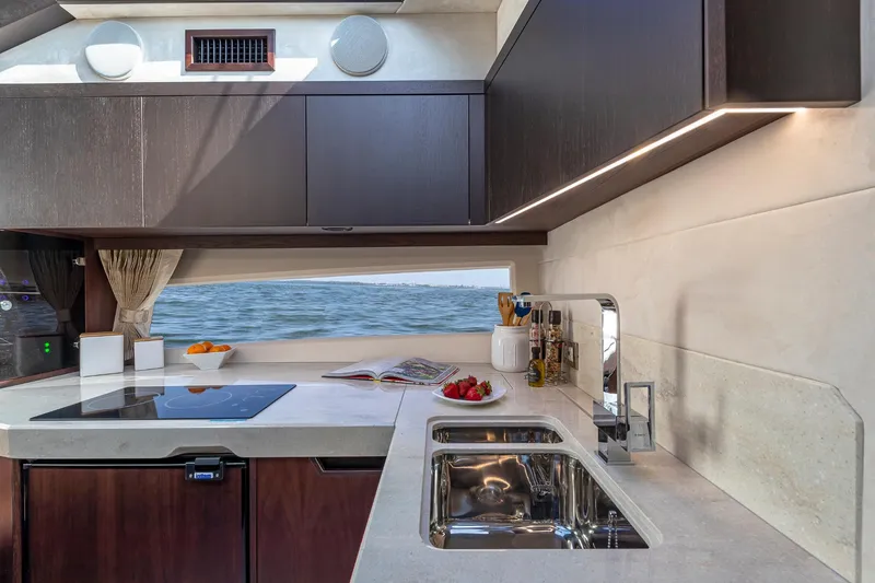 Slide: The Image of Modern kitchen interior of 2023 Galeon 425 HTS yacht with sea view. - 18