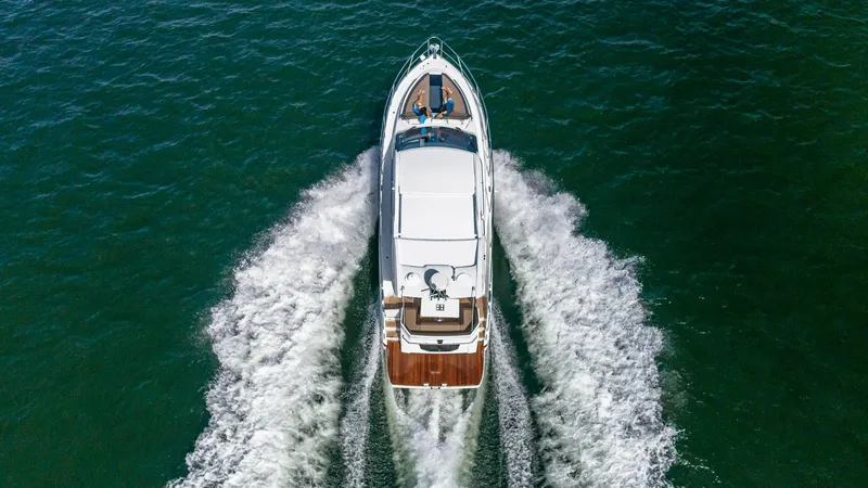 Slide: The Image of Aerial view of 2023 Galeon 425 HTS yacht cruising on open water. - 2