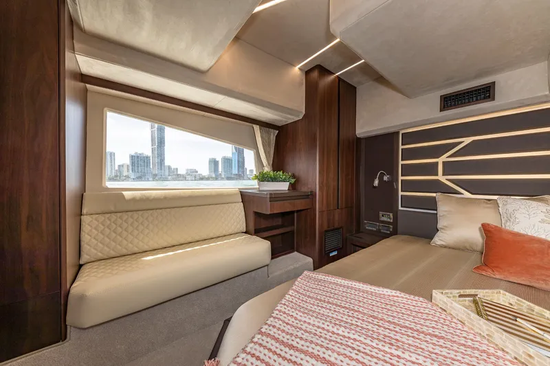 Slide: The Image of Luxurious interior of the 2023 Galeon 425 HTS yacht with city skyline view. - 20