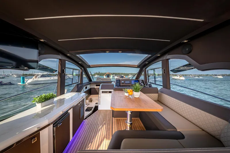 Slide: The Image of Interior of 2023 Galeon 425 HTS yacht with modern design and waterfront view. - 9