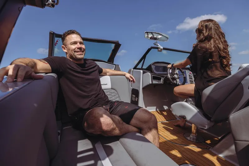 Slide: The Image of 2023 MasterCraft X22 boat interior with passengers enjoying a sunny day. - 10