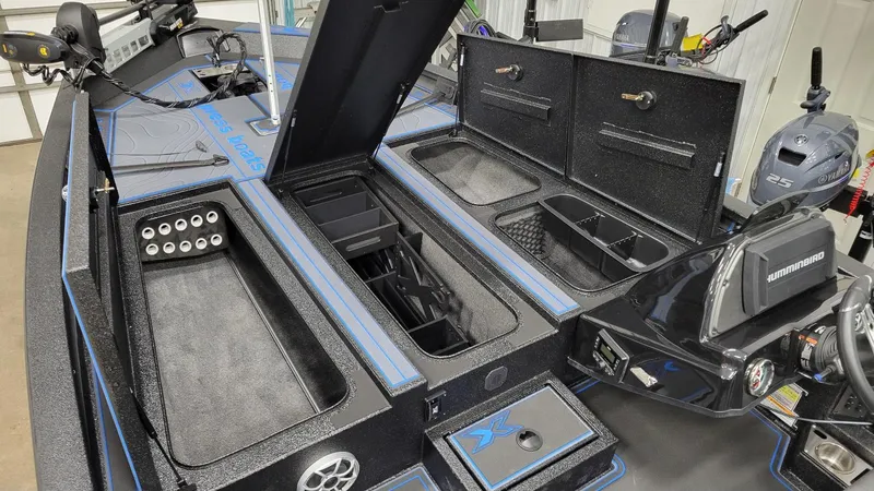 Slide: The Image of 2025 Xpress X21 Pro Bass boat interior with Yamaha Vmax 250 engine, featuring storage compartments. - 15