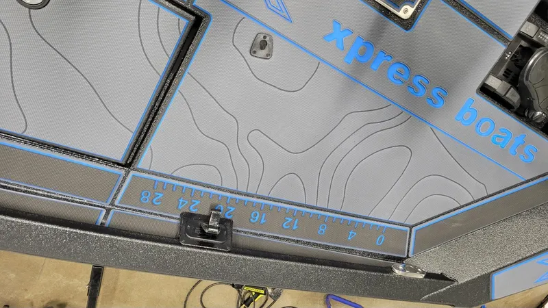 Slide: The Image of 2025 Xpress X21 Pro Bass boat deck with contour design and measurement markings. - 19