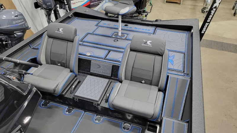 Slide: The Image of 2025 Xpress X21 Pro Bass boat interior with Yamaha Vmax 250 engine, featuring comfortable seating. - 21