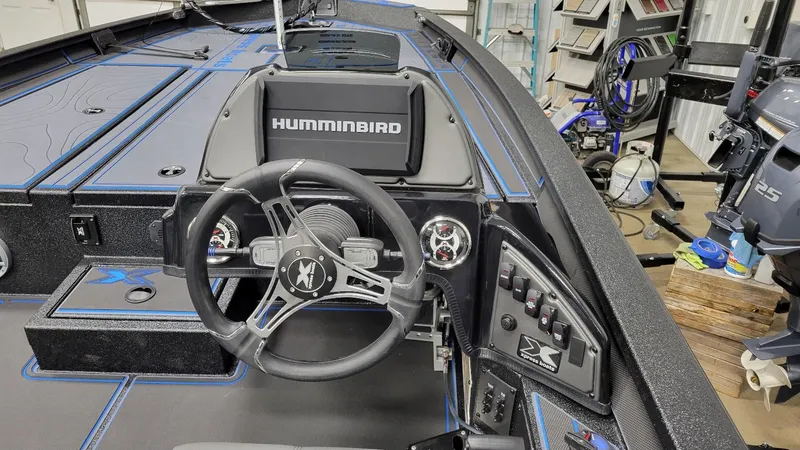 Slide: The Image of 2025 Xpress X21 Pro Bass boat interior with Yamaha Vmax 250 engine, featuring Humminbird electronics. - 22