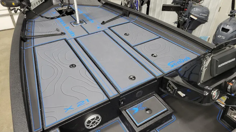 Slide: The Image of 2025 Xpress X21 Pro Bass boat deck with Yamaha Vmax 250 engine, featuring SeaDek flooring. - 6
